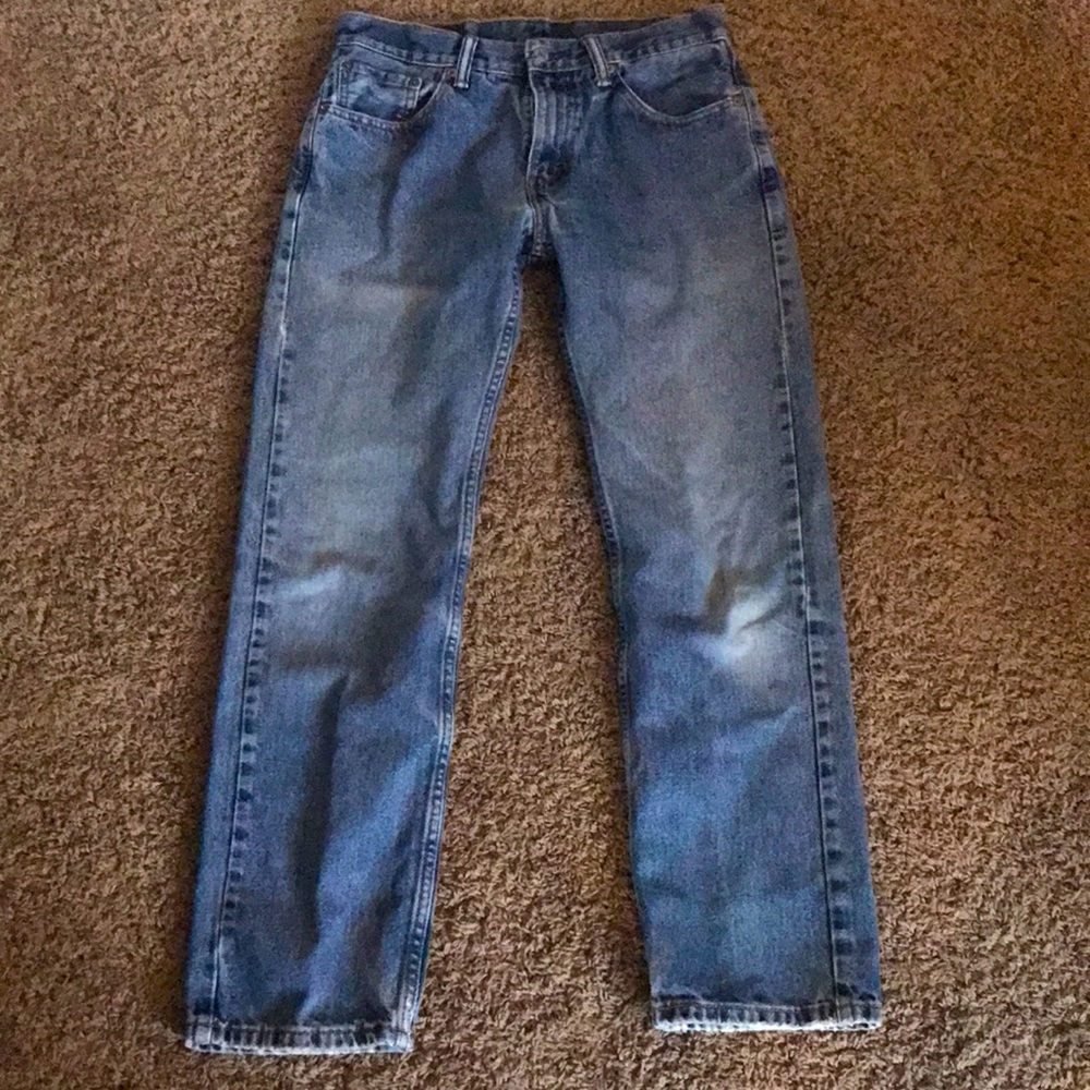 Lightly distressed Levi’s 505 jeans. Note these run a little small.